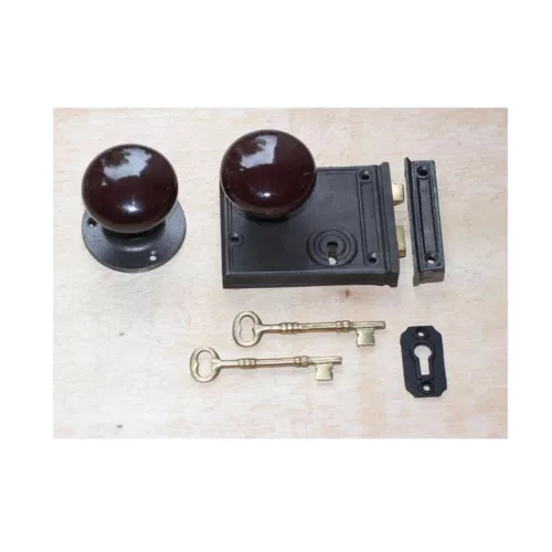 Horizontal cast iron rim lock with brown porcelain knobs