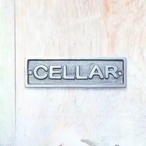 Cast iron cellar sign
