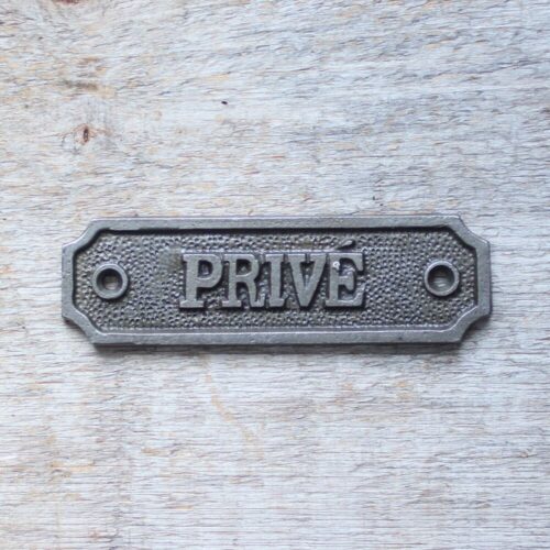 Privé cast iron sign